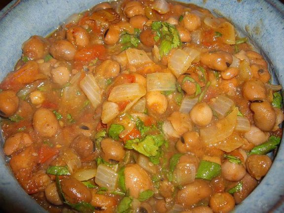 Chickpeas, fava beans dressed up with chopped tomato,